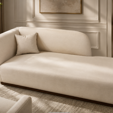 Monaco Chaise Lounge handcrafted with a premium solid teak wood frame, elegant ivory fabric upholstery, and a modern sculptural design for contemporary living spaces.