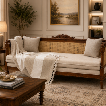 Heritage Cane Sofa handcrafted from premium solid teak wood with natural handwoven cane panels, carved detailing, and upholstered cushions for timeless comfort and elegance